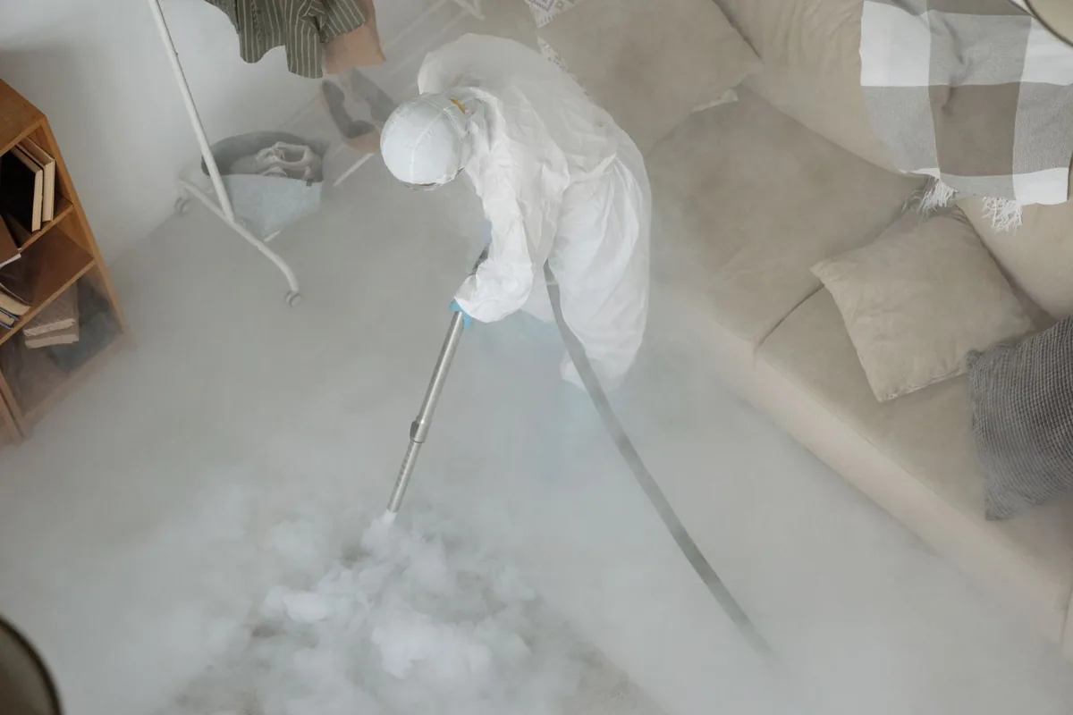 Biohazard cleanup technician in protective equipment, Alturas, CA